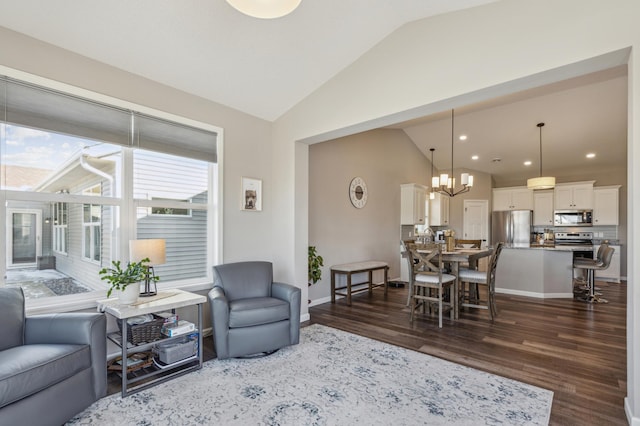 living area featuring baseboards, dark wood-style floors, and vaulted ceiling