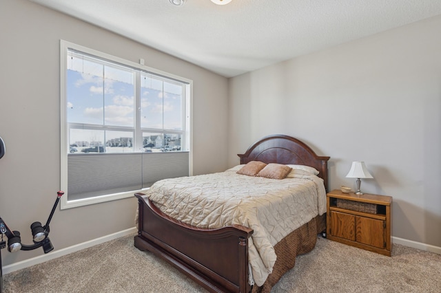 carpeted bedroom with baseboards