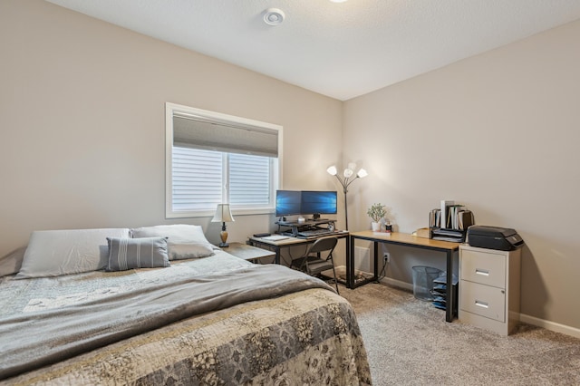 carpeted bedroom with baseboards