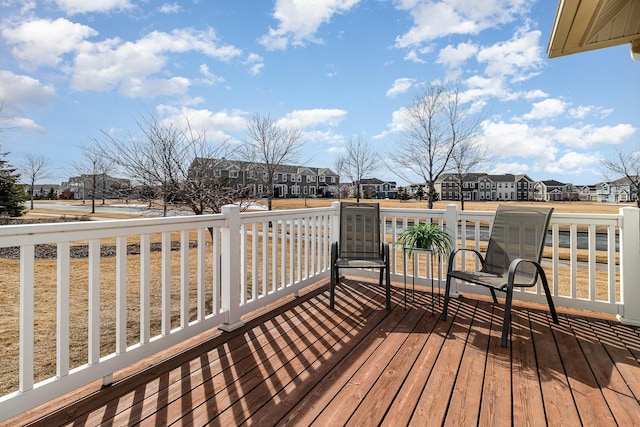 wooden terrace with a residential view