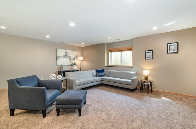 carpeted living area with visible vents, recessed lighting, and baseboards