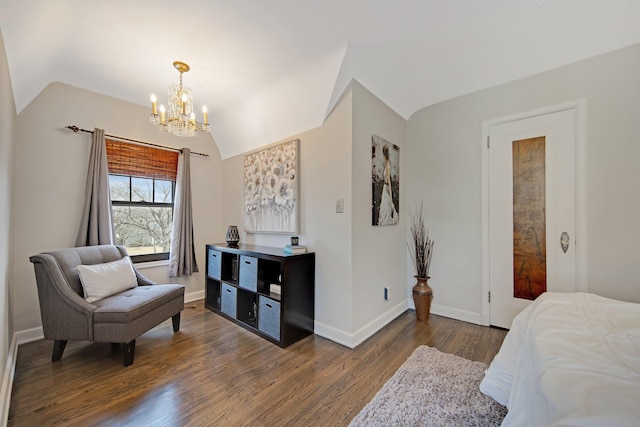 bedroom featuring vaulted ceiling, a notable chandelier, wood finished floors, and baseboards