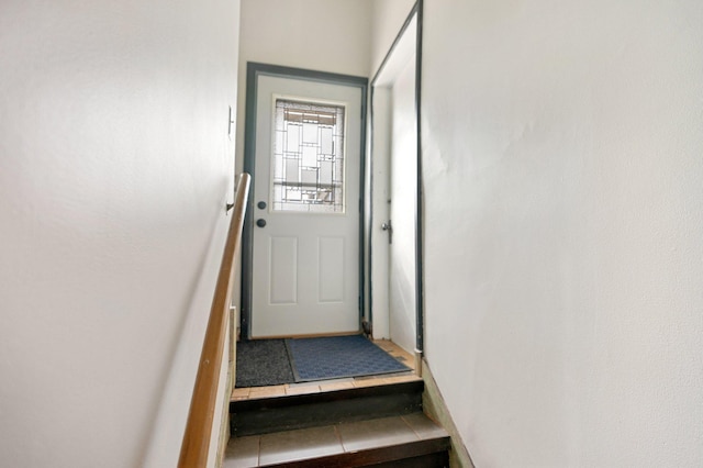 doorway featuring tile patterned flooring