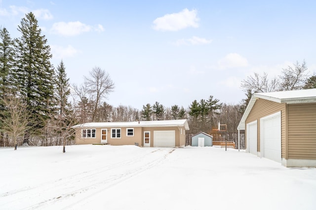 exterior space featuring an outbuilding and a detached garage