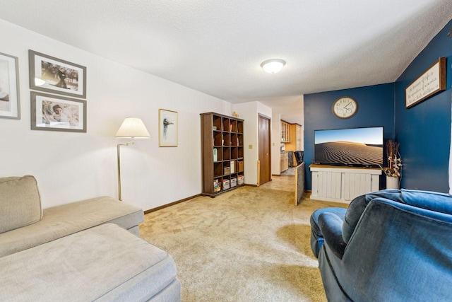 living room with light carpet, a textured ceiling, and baseboards