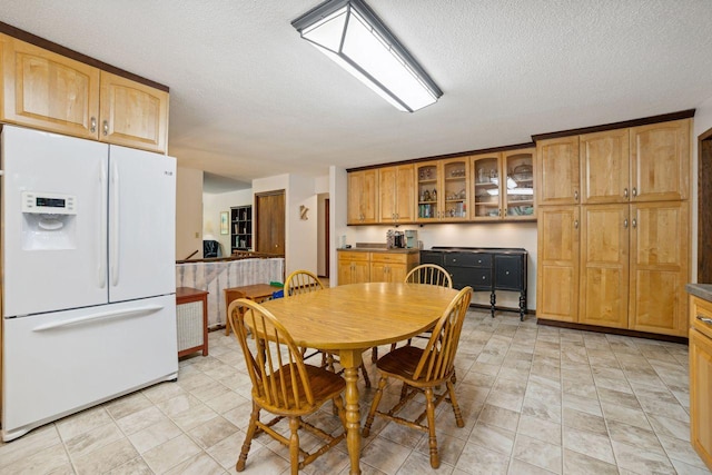 dining room with a textured ceiling