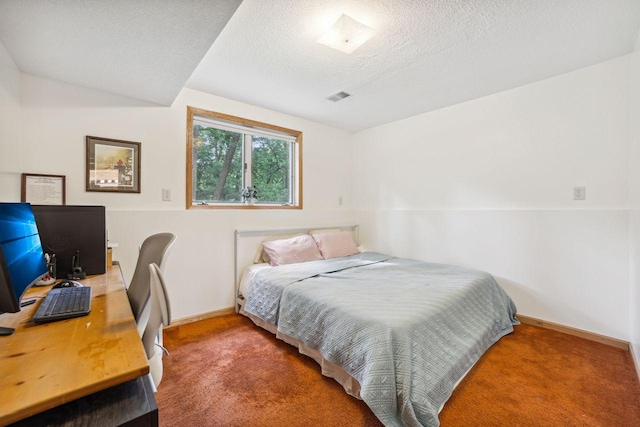 carpeted bedroom featuring visible vents, a textured ceiling, and baseboards