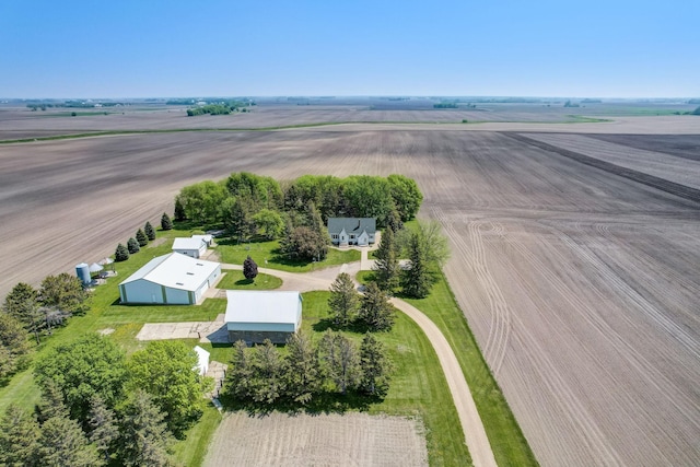 birds eye view of property with a rural view