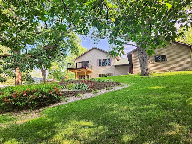 908 Park Ln, Belle Plaine, MN 56011 - rear view of house featuring a yard and a balcony