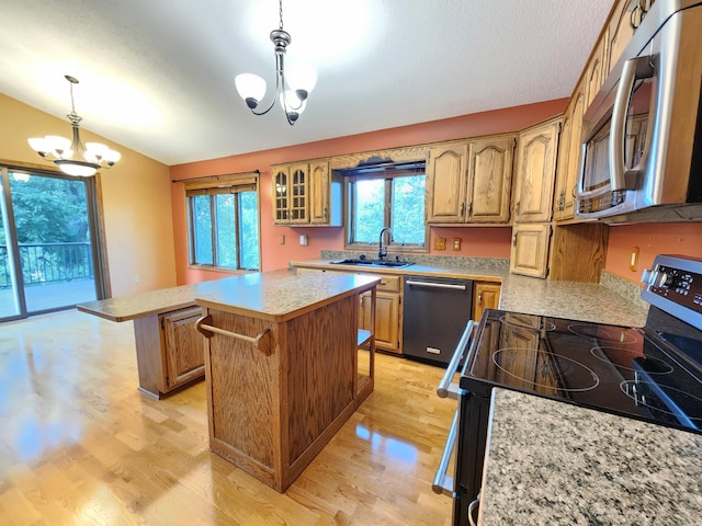 908 Park Ln, Belle Plaine, MN 56011 - kitchen with dishwashing machine, range with electric cooktop, a chandelier, stainless steel microwave, and light countertops