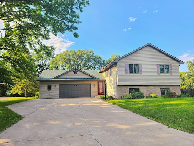 908 Park Ln, Belle Plaine, MN 56011 - view of front of house featuring an attached garage, concrete driveway, and a front yard
