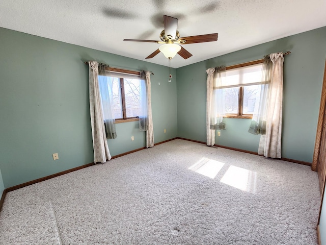 908 Park Ln, Belle Plaine, MN 56011 - empty room with ceiling fan, carpet, and a textured ceiling