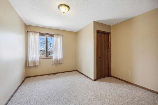 908 Park Ln, Belle Plaine, MN 56011 - empty room with light carpet and a textured ceiling