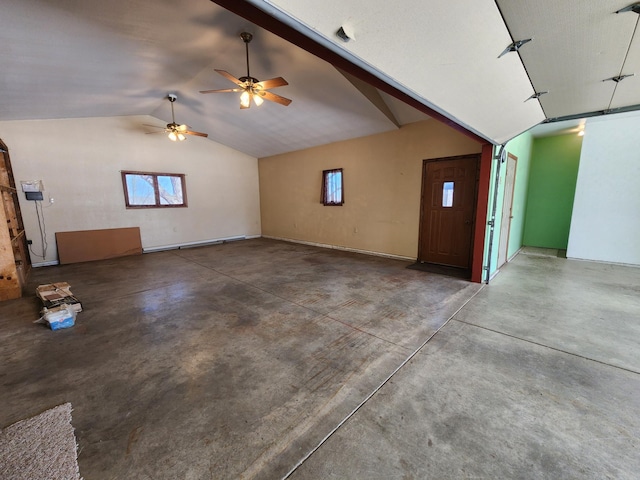 908 Park Ln, Belle Plaine, MN 56011 - unfurnished living room featuring lofted ceiling, concrete flooring, ceiling fan, and healthy amount of natural light
