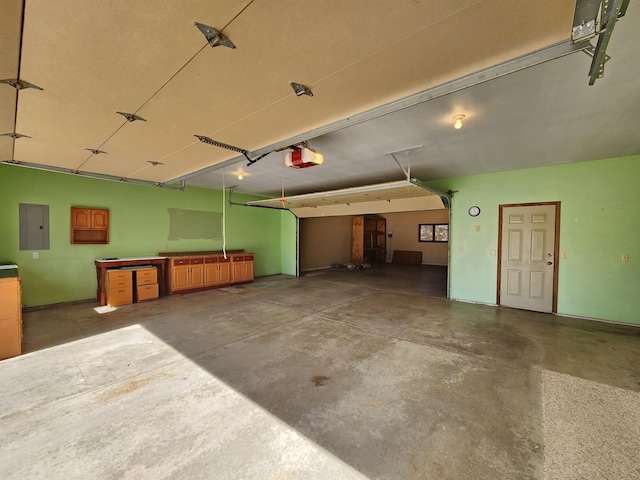 908 Park Ln, Belle Plaine, MN 56011 - garage featuring electric panel and a garage door opener