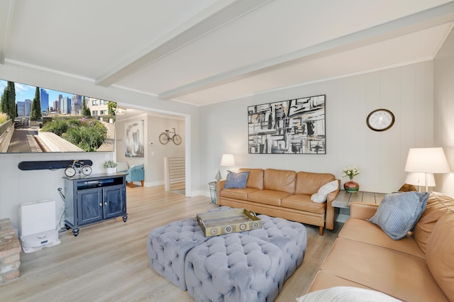 living area with beamed ceiling and light wood finished floors