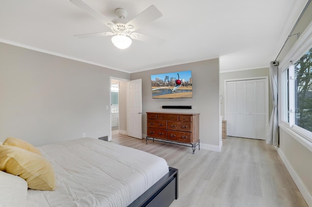 bedroom with ceiling fan, crown molding, light wood-type flooring, and baseboards