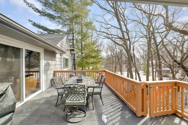 wooden deck featuring outdoor dining space