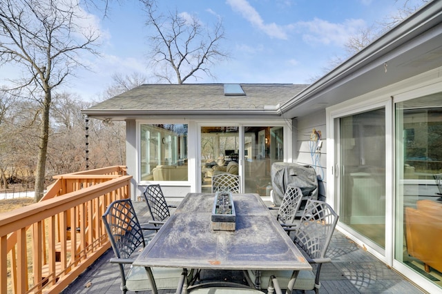 wooden terrace featuring outdoor dining space