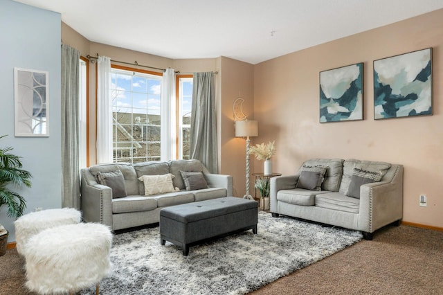 living area featuring carpet floors and baseboards