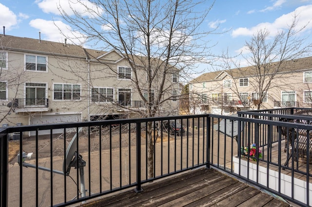 wooden deck with a residential view