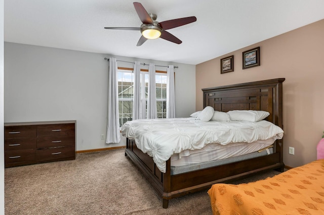 carpeted bedroom featuring ceiling fan and baseboards