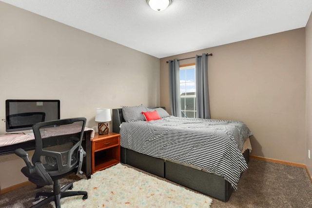 bedroom featuring carpet flooring and baseboards