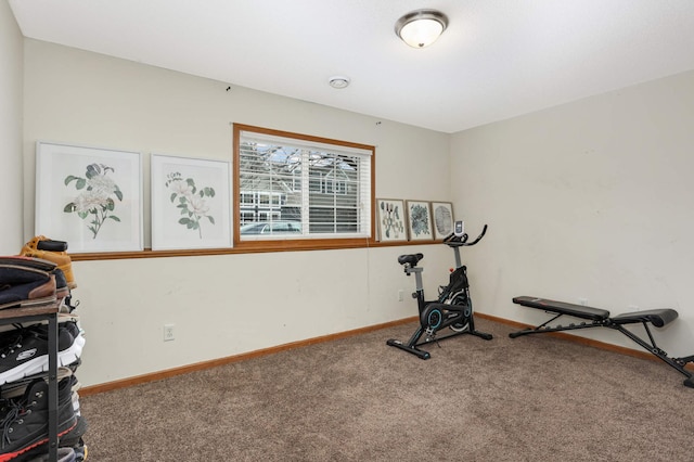 workout area with carpet floors and baseboards