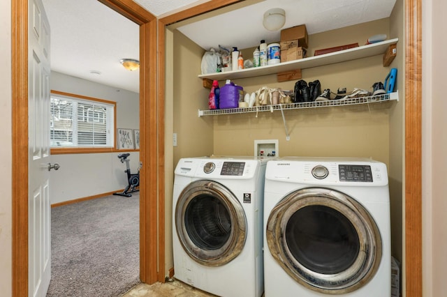 washroom featuring baseboards, laundry area, washer and clothes dryer, and light colored carpet