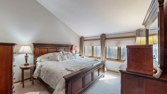 bedroom featuring light carpet, lofted ceiling, a textured ceiling, and baseboards