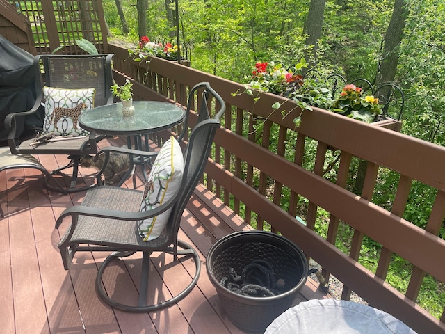 deck with outdoor dining area
