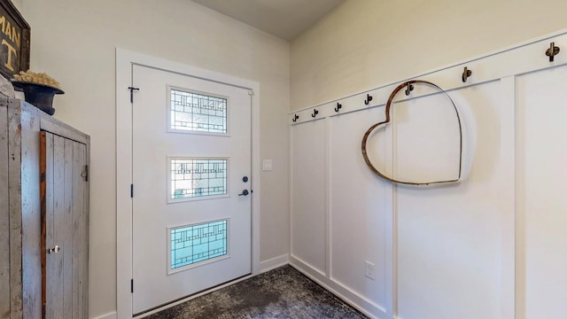 entryway featuring unfinished concrete flooring