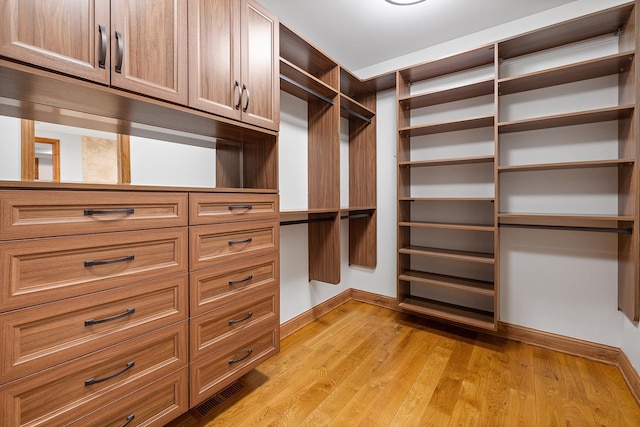 walk in closet featuring light wood-style floors