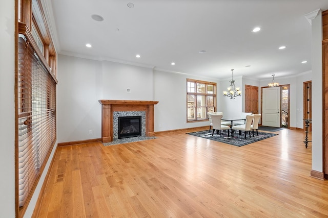 1328 Riverside Ln, Mendota Heights, MN 55118 - living room with a chandelier, a tiled fireplace, baseboards, light wood-style flooring, and ornamental molding