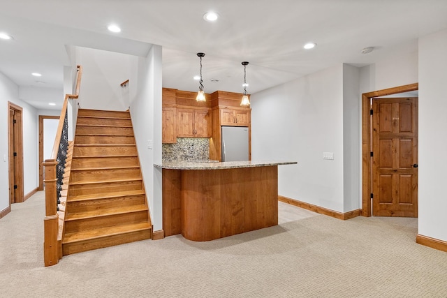 1328 Riverside Ln, Mendota Heights, MN 55118 - kitchen featuring freestanding refrigerator, light colored carpet, baseboards, recessed lighting, and light stone countertops