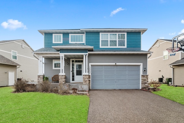 view of front facade featuring aphalt driveway, stone siding, a garage, and a front yard