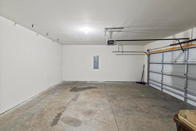 garage featuring electric panel and a garage door opener