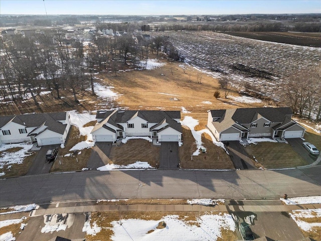 snowy aerial view featuring a residential view