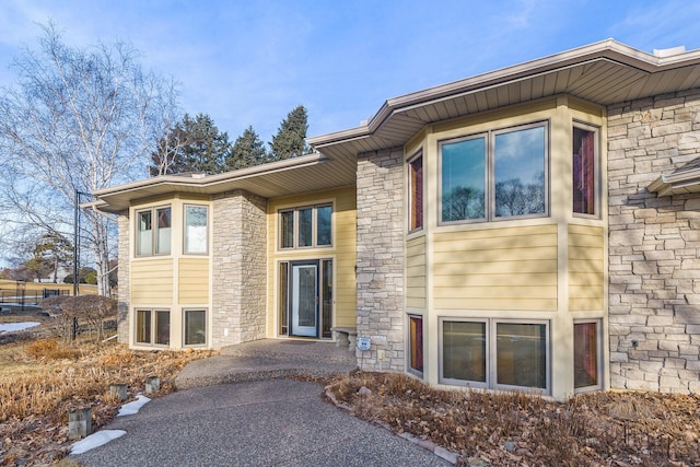 view of front of property featuring stone siding