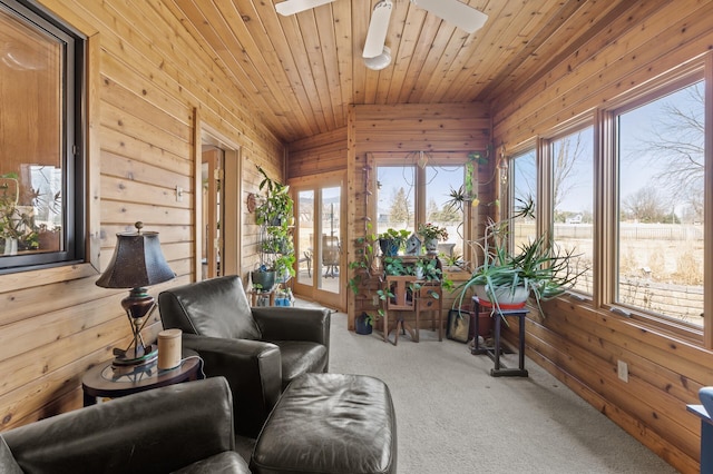 sunroom with wooden ceiling, a ceiling fan, and lofted ceiling