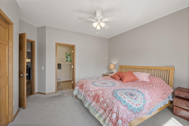 carpeted bedroom with visible vents, ceiling fan, and baseboards