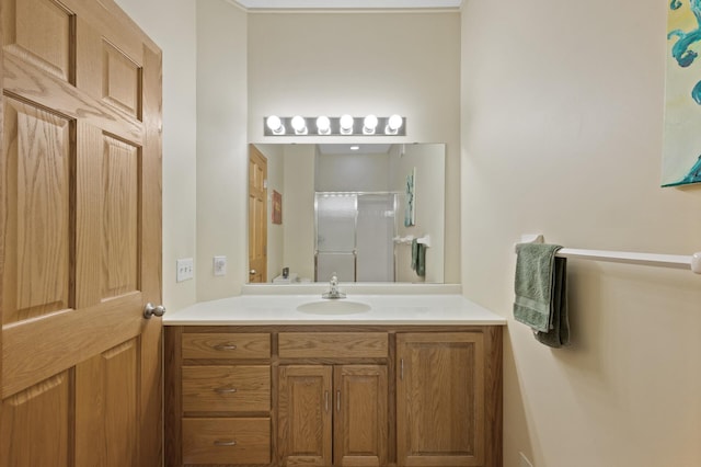 bathroom featuring vanity and a shower stall