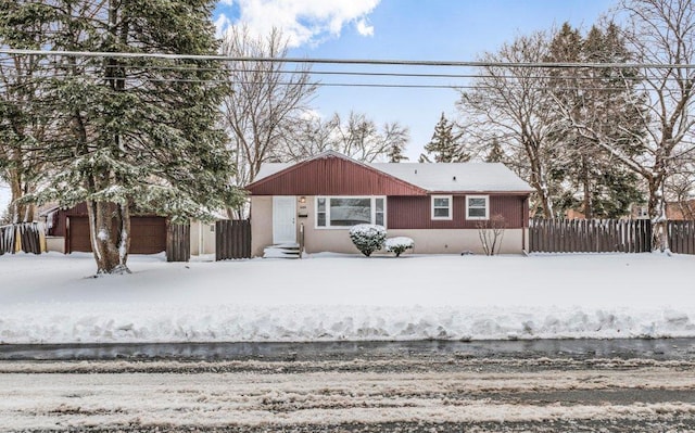 view of front of home featuring fence