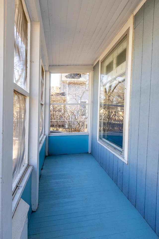 unfurnished sunroom featuring wooden ceiling