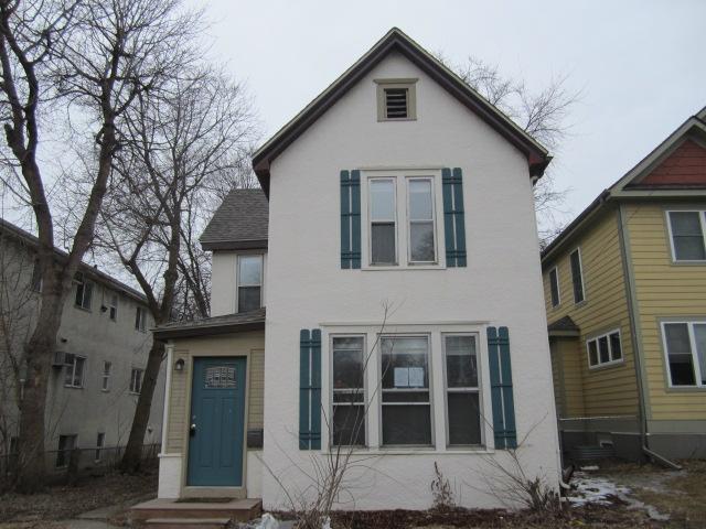 view of front of home featuring roof with shingles and stucco siding