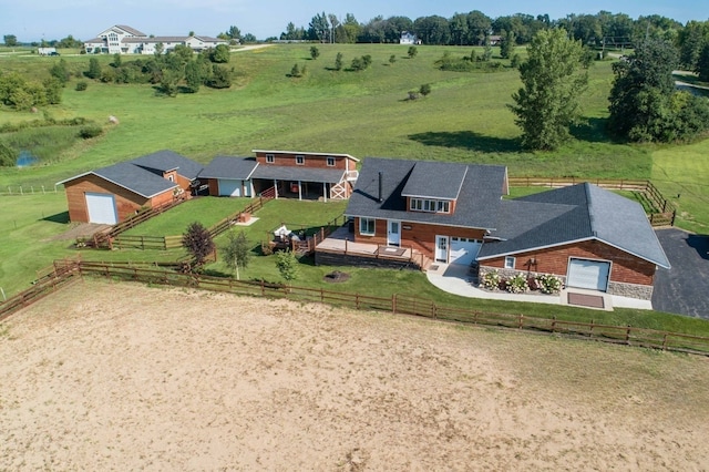 birds eye view of property with a rural view