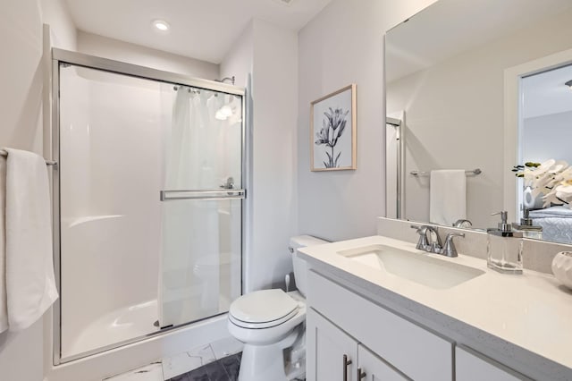 ensuite bathroom featuring toilet, vanity, marble finish floor, a stall shower, and ensuite bath