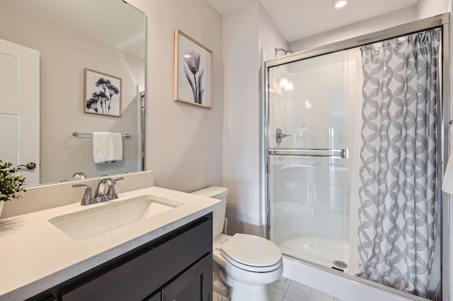 full bath featuring a stall shower, vanity, and toilet