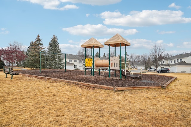 community play area featuring a lawn