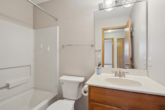 bathroom featuring shower / washtub combination, vanity, and toilet